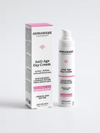 Aromanesque Anti-Age Day Cream packaging and container, with the product emphasizing hyaluronic acid and marine extracts.