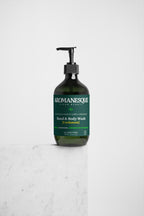 A pump bottle of Aromanesque Hand & Body Wash with Ginger & Smoky Cardamom label, placed against a white background.